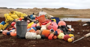 Buoys, floats, and other marine debris piled up after a cleanup.