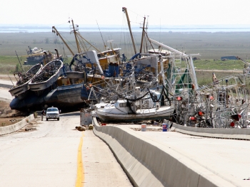 Vessels piled up on a highway following Hurricane Katrina (Photo Credit: Federal Emergency Management Agency).