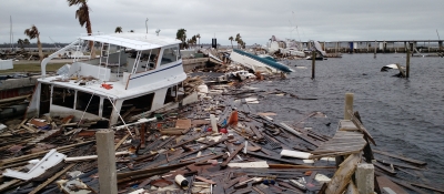 A sunken vessel and floating lumber are a result of Hurricane Michael.