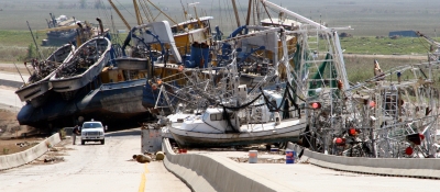 Vessels piled up on a highway following Hurricane Katrina (Photo Credit: Federal Emergency Management Agency).