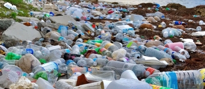 A beach littered with plastic debris.