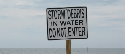 Storm debris beach sign.
