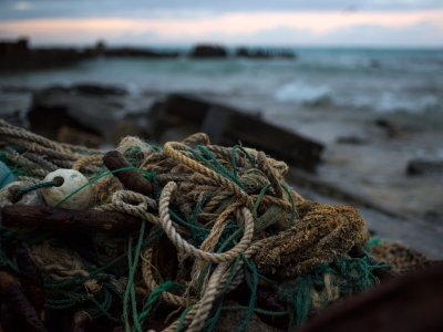 A derelict fishing net washed up on the rocky shores of Sand Island, Midway Atoll. 