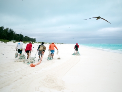 The Marine Debris team removing derelict fishing nets from North Beach, Sand Island, Midway Atoll. (Photo Credit: NOAA CREP)