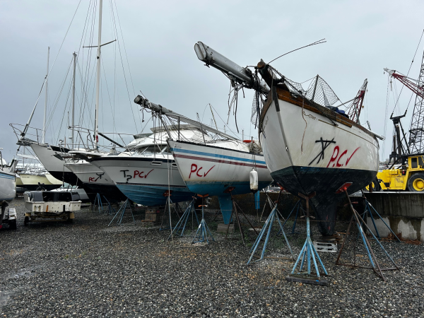 Four abandoned and derelict vessels in a shipyard to be recycled.