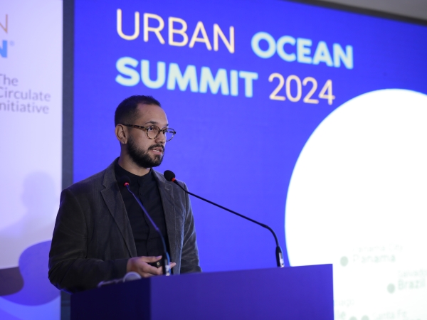 A speaker giving opening remarks at the Urban Ocean Summit.