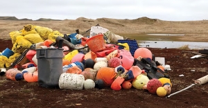 Debris removed during a cleanup on St. Paul Island, Alaska (Credit: Veronica Padula). Buoys, floats, and other marine debris piled up after a cleanup.