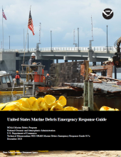 Floats are being utilized by volunteers to contain random debris, caused by demolition of a home destroyed by Hurricane Sandy, from moving further into Barnegat Bay during the removal process.