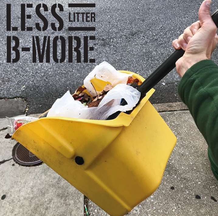 A yellow bucket holds a lot of garbage that was collected from a street.