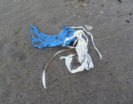 Remnants of rubber balloons with strings attached. (photo: Russ Lewis)